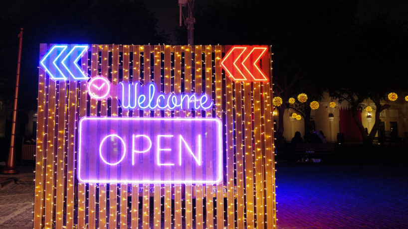 Welcome Open sign at the Tasty Street at the Katara Cultural Village in Doha, Qatar.