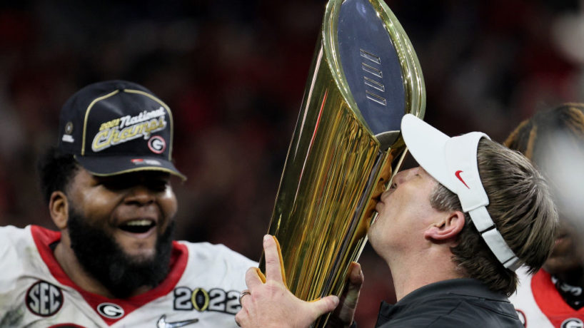 Kirby Smart kisses CFB Playoff trophy