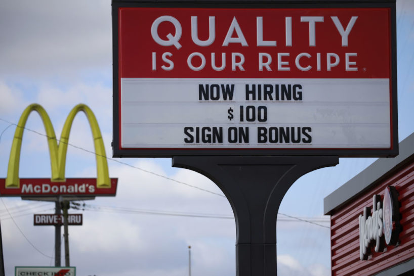 A 'Now Hiring' sign outside a Wendy's fast food restaurant in Seymour, Indiana, U.S., on Monday, Dec. 6, 2021. U.S. job openings jumped in October to the second-highest on record, underscoring the ongoing challenge for employers to find qualified workers for an unprecedented number of vacancies. Photographer: Luke Sharrett/Bloomberg via Getty Images