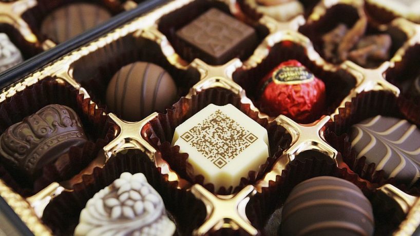 A box of chocolates contains a piece decorated with a URL written in two-dimensional code on June 29, 2006 in Tokyo, Japan.