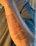 This is a photograph of homicide suspect Briean Brown Jr.'s left forearm with the word risky tattooed on it.