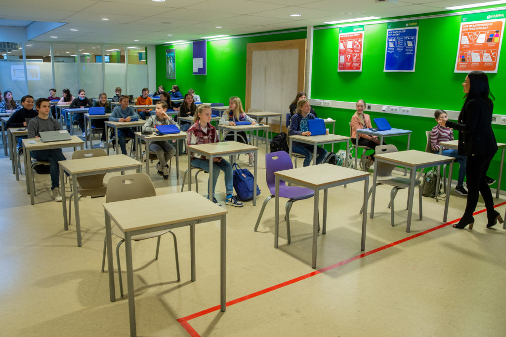 classroom of students with teacher in front instructing