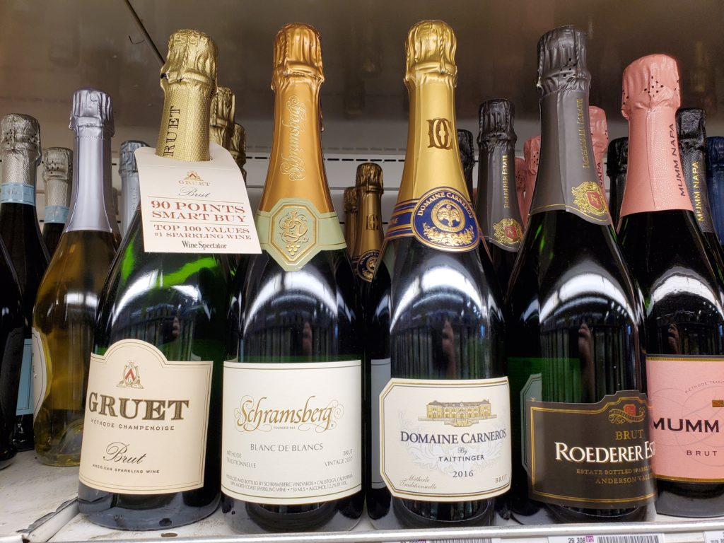 bottle of champagne lined up on counter