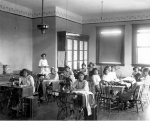 Children in a classroom at a federal Indian boarding school