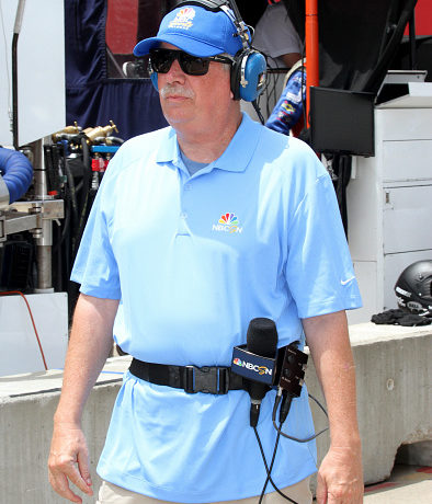 A photo of Robin Miller covering an Indycar race for NBC Sports