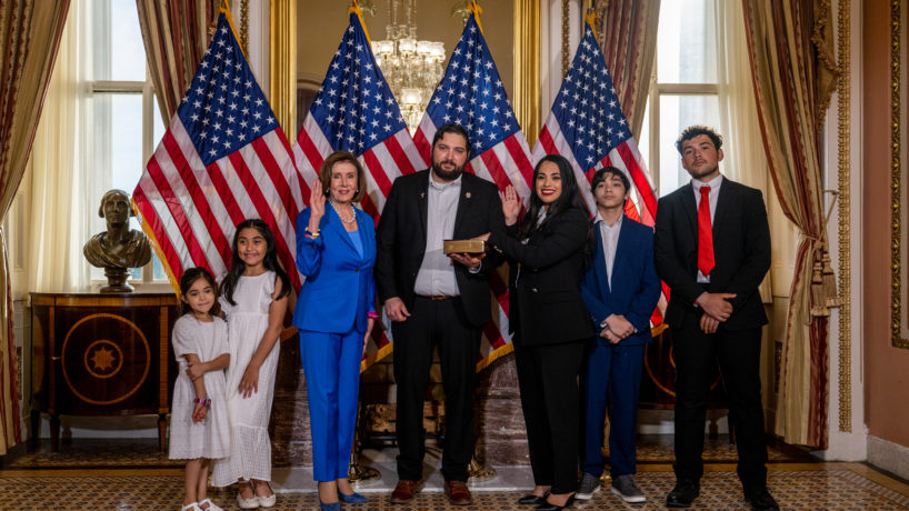 Flores (R-TX) stands with her family and Pelosi