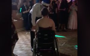 Prom queen in wheelchair reacts to offensive lyrics in song.