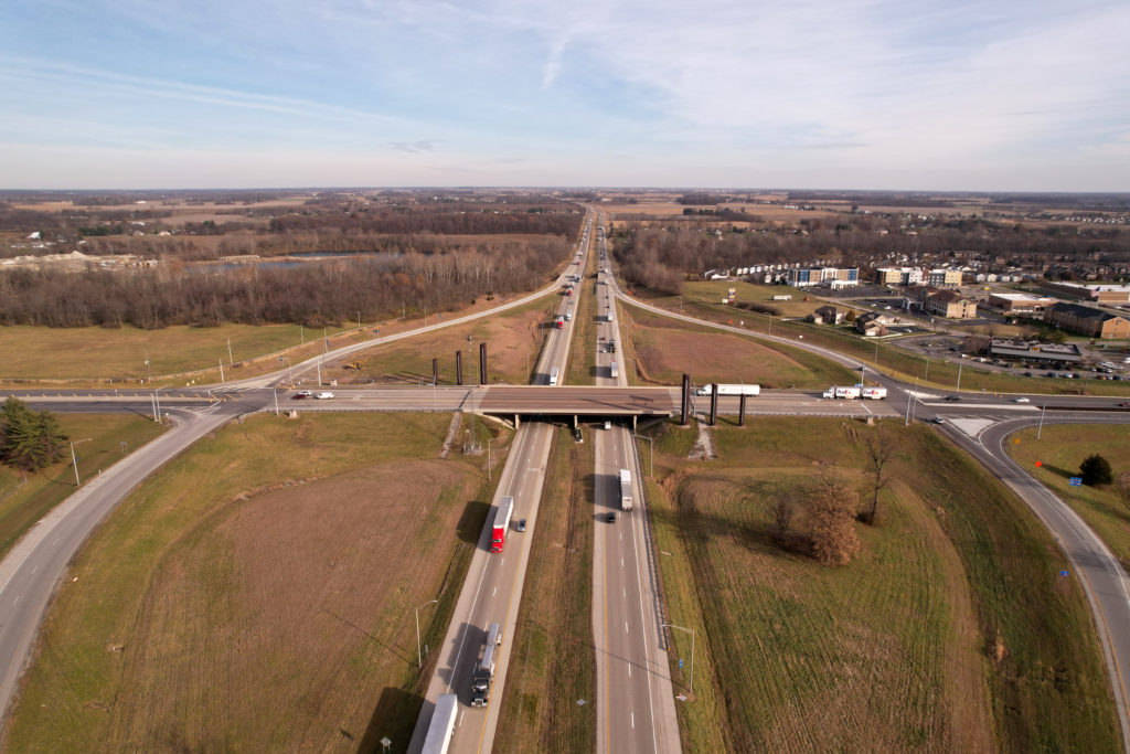 Trucks travel along Interstate 70 highway in Greenfield, Indiana