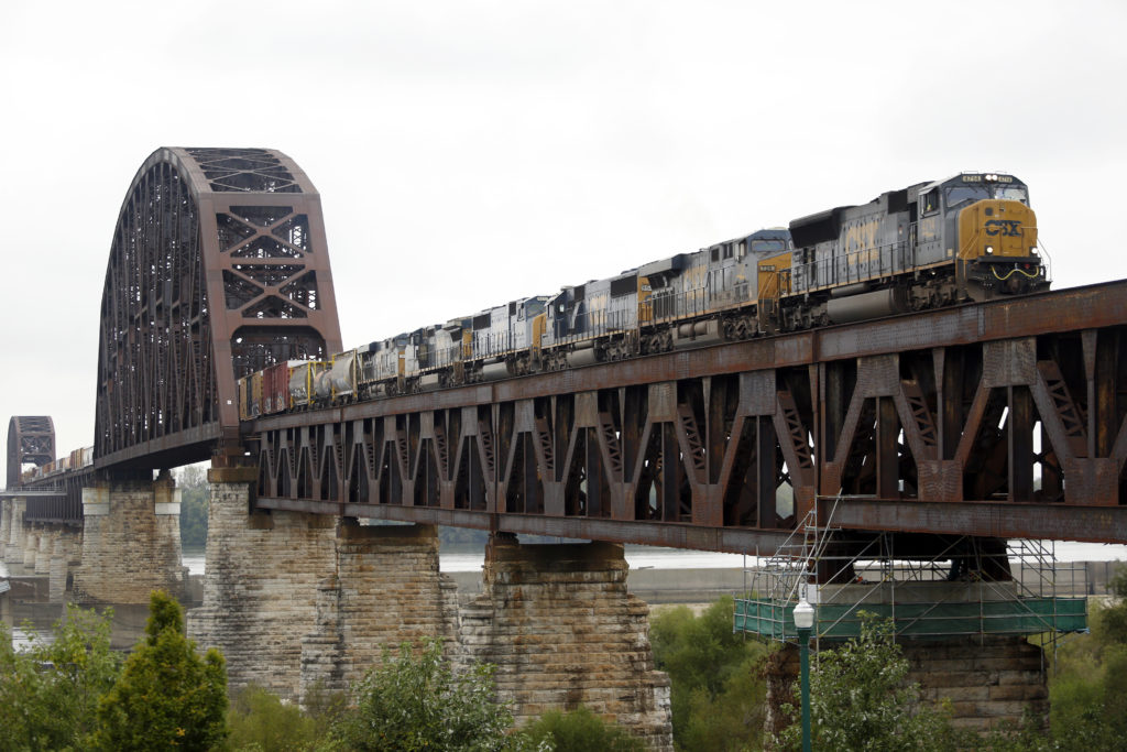 A CSX Corp. freight train crosses a bridge over the Ohio River into Clarksville, Indiana