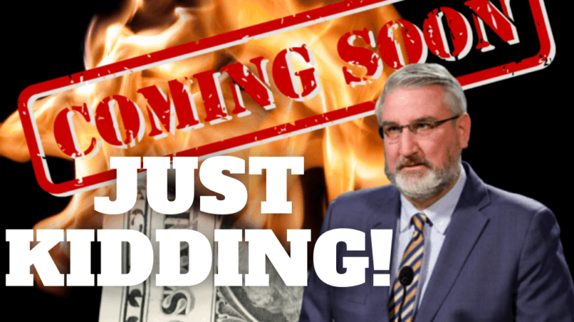 Eric Holcomb stands in front of a pile of burning money and the words "coming soon" in bright red.