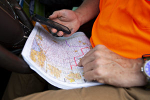 A participant reviews a map of Indiana during a stop on the Midwest Crop Tour near Delphi, Indiana