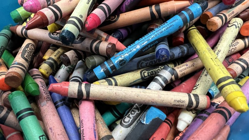 Close-up of a large pile of Crayola crayons in assorted colors