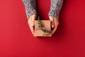 Hands holding Christmas gift box