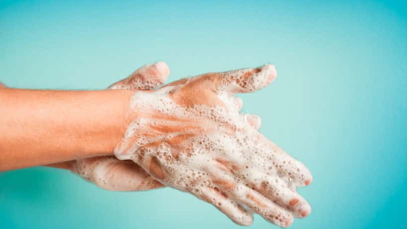 Closeup of person washing hands isolated. Cleanliness and body care concept.