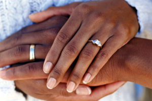 married couple holding hands