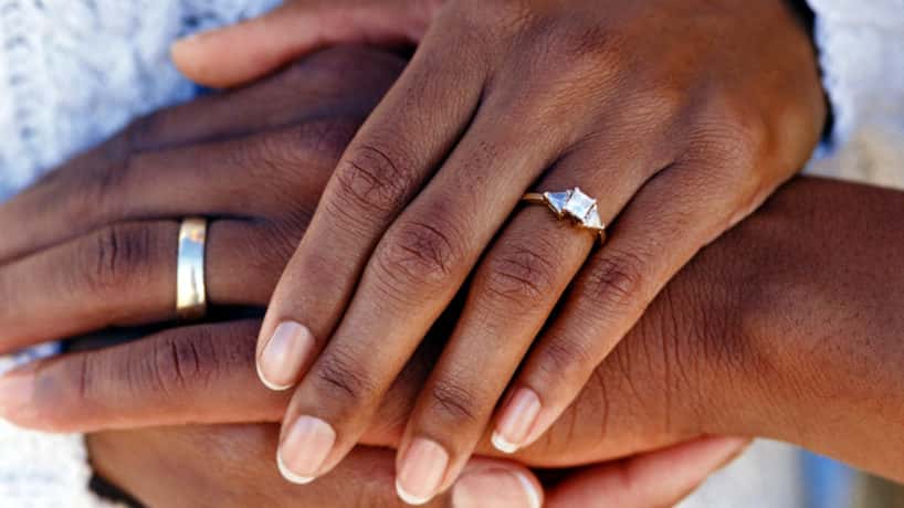married couple holding hands