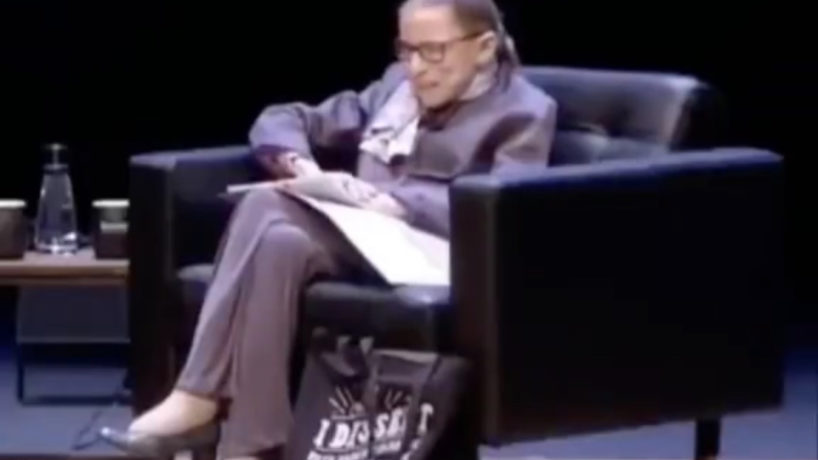 Ruth Bader Ginsburg sitting on a speaking panel