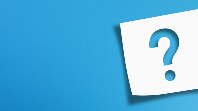 Note paper with question mark on panoramic blue background