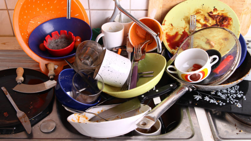 huge heap of dirty disgusting dishes in the sink waiting to be washed by unreliable flatmate