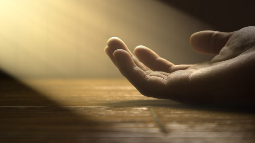 The god is holding the hand of the man who fell in the darkness.