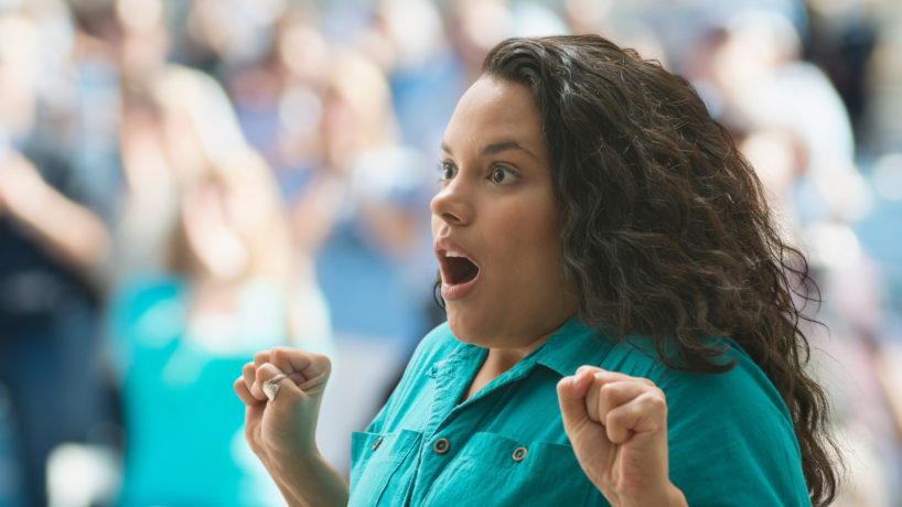 Shocked female spectator - stock photo