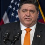 Illinois Gov. J.B. Pritzker gives a COVID-19 update to reporters in the Blue Room at the Thompson Center in Chicago, Wednesday, Feb. 9, 2022. (Tyler LaRiviere/Chicago Sun-Times via AP)