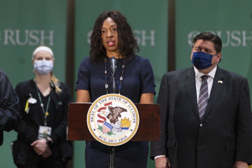 Illinois Public Health Director Dr. Ngozi Ezike announces she is stepping down, effective later this month, during an news conference at Rush Hospital, Tuesday, March 1, 2022. The 49-year-old pediatrician has been an ever-present sidekick of Gov. J.B. Pritzker's since the coronavirus made its Illinois debut in January 2020. Her last day will be March 14. (Anthony Vazquez/Chicago Sun-Times via AP)