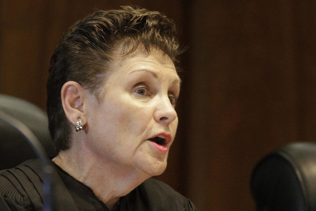 FILE - Illinois Supreme Court Justice Rita Garman speaks Monday, Oct. 31, 2016, in Springfield, Ill. Garman, who had planned to seek a third 10-year term in November, abruptly tendered her resignation Monday, May 9, 2022. The state's longest-serving jurist, appointed to the bench at age 31, said in a statement she will retire on July 7. (AP Photo/Seth Perlman, File)