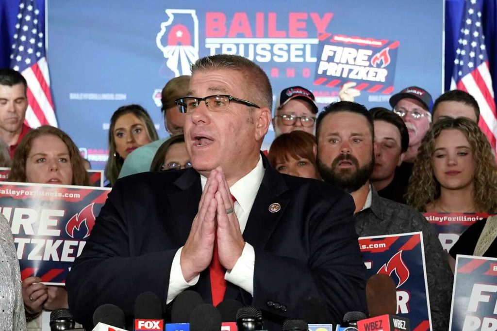 Republican gubernatorial candidate Darren Bailey responds to reporters questions after winning the Republican gubernatorial primary Tuesday, June 28, 2022, in Effingham, Ill. Bailey will now face Democratic Gov. J.B. Pritzker in the fall. (AP Photo/Charles Rex Arbogast)