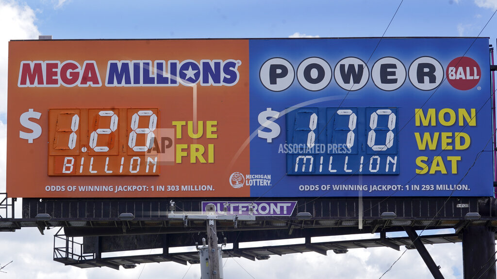 A sign displays the Mega Millions lottery jackpot in Detroit, Friday, July 29, 2022. The Mega Millions lottery jackpot keeps getting larger as officials raised the massive prize to $1.28 billion on Friday, just hours before the next drawing.(AP Photo/Paul Sancya)