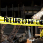 fire-line-in-front-of-a-destroyed-home