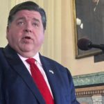 FILE - Illinois Gov. J.B. Pritzker addresses reporters on April 7, 2022, in Springfield, Ill. Democrats who run state government celebrated while announcing that tax-rebate checks — totaling more than $1.2 billion — on Monday, Sept. 12, 2022, began heading to 6 million taxpayers. With just eight weeks before the election, the timing is perfect for Pritzker, Comptroller Susana Mendoza, who shared Monday's spotlight, and virtually every member of the General Assembly. (AP Photo/John O'Connor, File)