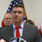 St. Charles County prosecutor Tim Lohmar, center, speaks at a news conference on Monday, Sept. 19, 2022, flanked by Lincoln County prosecutor Michael Wood, left, and St. Louis County prosecutor Wesley Bell at the St. Louis County government building in Clayton, Mo. St. Louis-area prosecutors say a convicted murderer serving a life sentence for killing a man in 1995 has confessed to strangling four women five years earlier. Prosecutors from Lincoln, St. Charles and St. Louis counties, which was where the victims’ bodies were found, said that Gary Muehlberg, a 73-year-old inmate at the Potosi Correctional Center in southeastern Missouri, confessed to the 1990 killings. (Christian Gooden/St. Louis Post-Dispatch via AP)