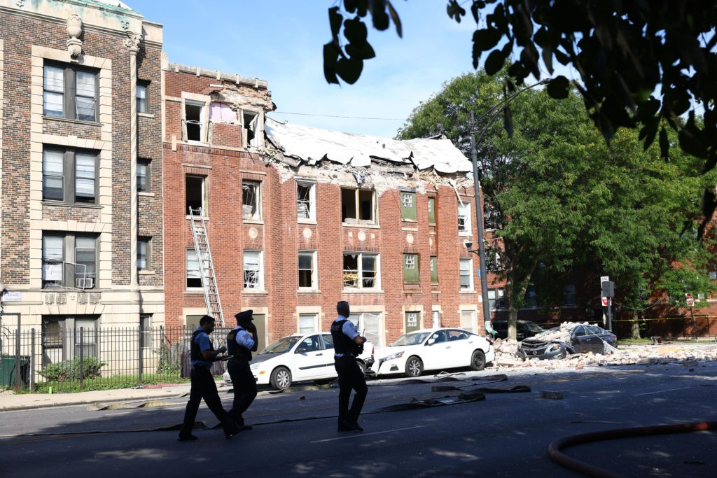 Fire crews respond to the scene of an explosion inside a building on Tuesday, Sept. 20, 2022, in Chicago. Several people were rushed to hospitals after being injured when an explosion on Tuesday morning tore through the top floor of an apartment building on Chicago's West Side and the fire department was requesting help to search the building, officials said. (Anthony Vazquez/Chicago Sun-Times via AP)