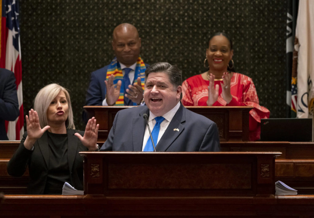 Gov. J.B. Pritzker delivers his combined budget and State of the State address in front of House Speaker Emanuel "Chris" Welch and Senate Majority Leader Kimberly Lightford to a joint session of the General Assembly on Wednesday, Feb. 15, 2023 at the Illinois State Capitol in Springfield, Ill. (Brian Cassella/Chicago Tribune via AP, Pool)