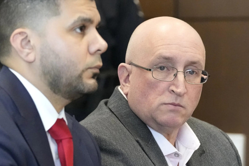 Robert E. Crimo Jr., right, and his attorney George Gomez, appear before Judge George D. Strickland at the Lake County Courthouse, Thursday, Feb. 16, 2023, in Waukegan, Ill. Crimo, the father of a man charged with fatally shooting seven people at a Fourth of July parade in suburban Chicago, entered a not guilty plea to charges that he helped his son obtain a gun license years before the attack. (AP Photo/Nam Y. Huh, Pool)