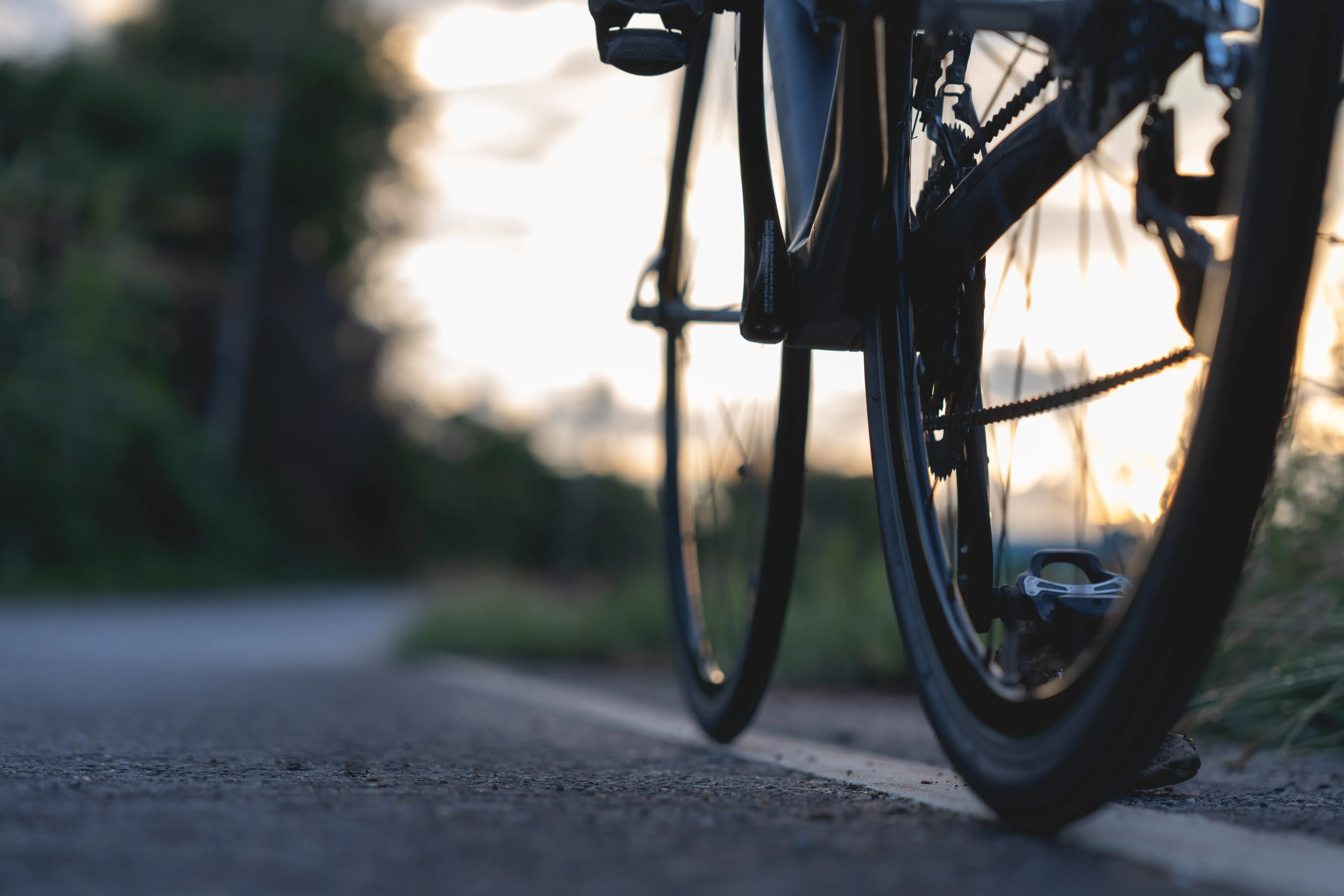 roadbikeparkedonabeautifulroadsunsetwarmlight