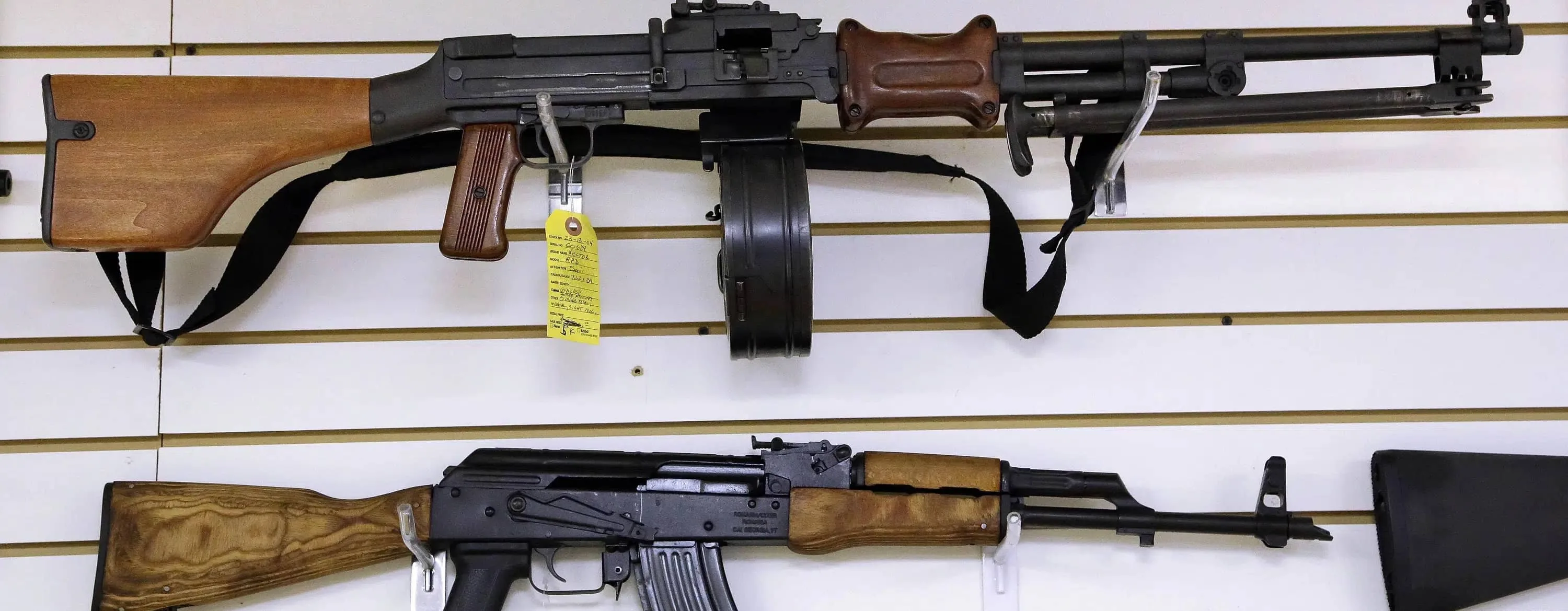 FILE - Assault weapons are seen for sale at Capitol City Arms Supply on Jan. 16, 2013 in Springfield, Ill. Legal challenges to Illinois' semiautomatic weapons ban began Wednesday, Jan. 18, 2023, with a federal complaint that the eight-day-old law prohibits “commonly possessed” and constitutionally protected guns and a state court pleading questioning the law's exemptions based on a person's employment. (AP Photo/Seth Perlman, File)