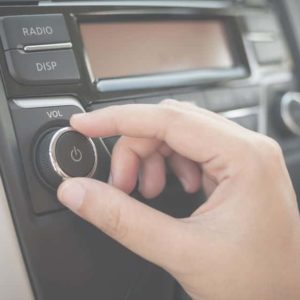 hand-tuning-fm-radio-button-in-car-panel