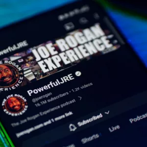 Joe Rogan experience podcast on smartphone screen.