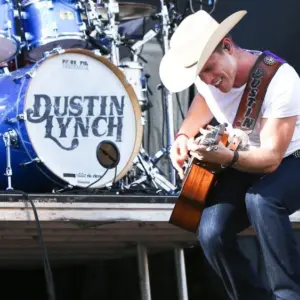 Dustin Lynch performs during the 'Kick The Dust Up' Tour at Vanderbilt Stadium on July 11^ 2015 in Nashville^ Tennessee.