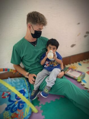 hayden-guatamal-with-child-in-nutrition-center-314x420-1