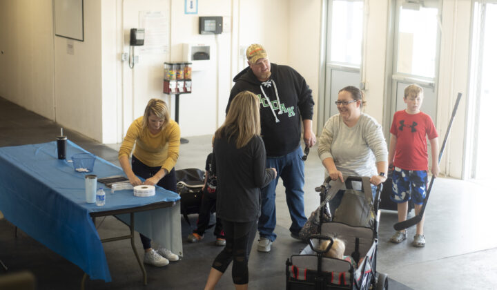 family-greeted-at-door-1-720x420-1