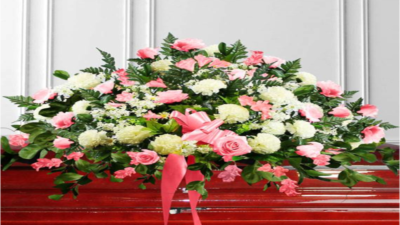 pink-flowers-casket-funeral-obit-1000x563