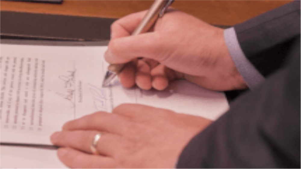 signing-bill-1000x563