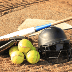 softball-gear-in-front-of-home-plate