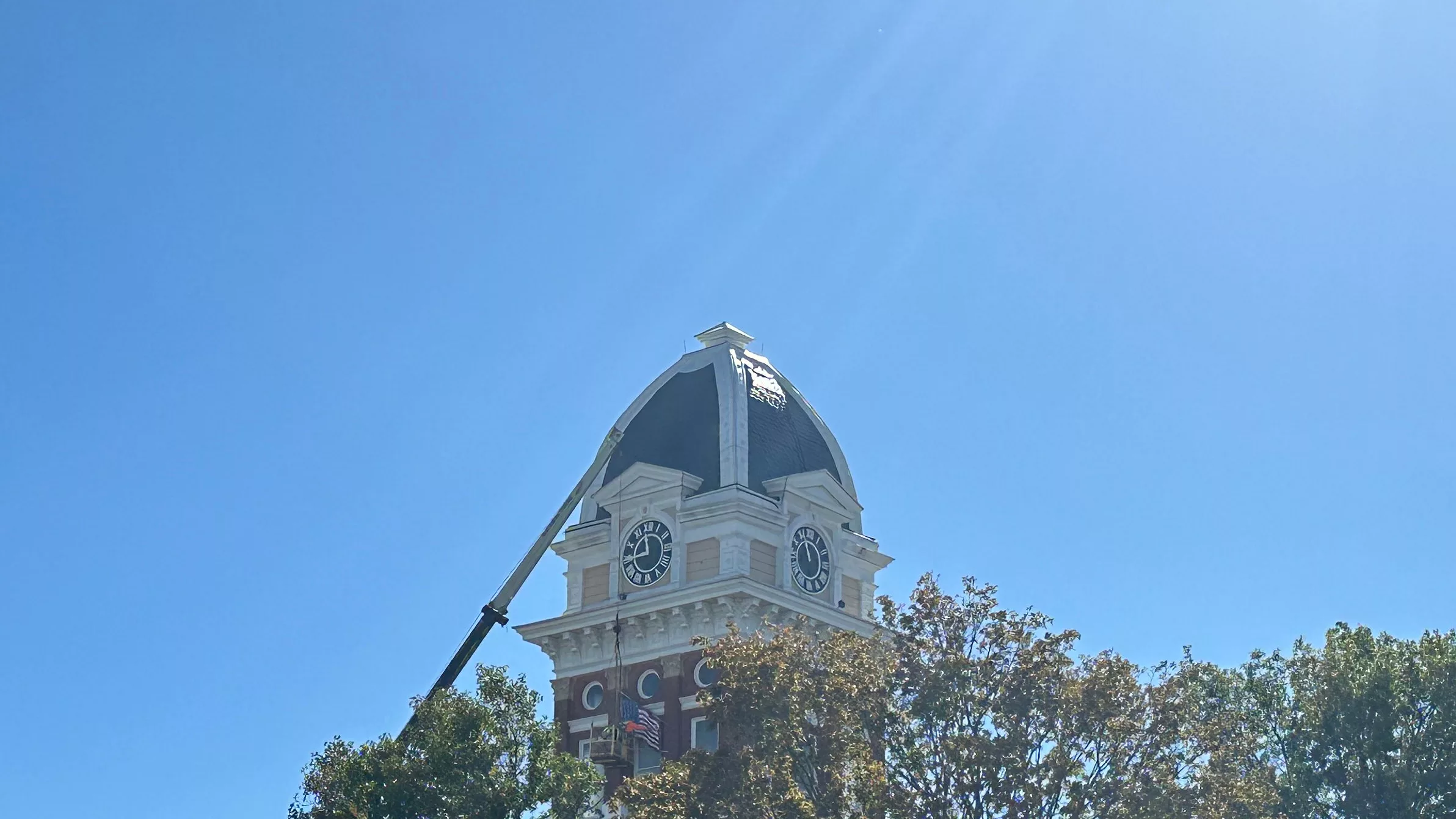 24-1018-salco-courthouse-flag-crane-sun-rays