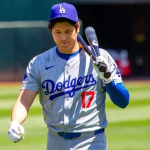 Los Angeles Dodgers designated hitter Shohei Ohtani walk on the field before a game against the Oakland Athletics at the Oakland Coliseum. Oakland^ California - August 4^ 2024