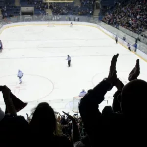 hockey fans applaud at ice hockey stadium