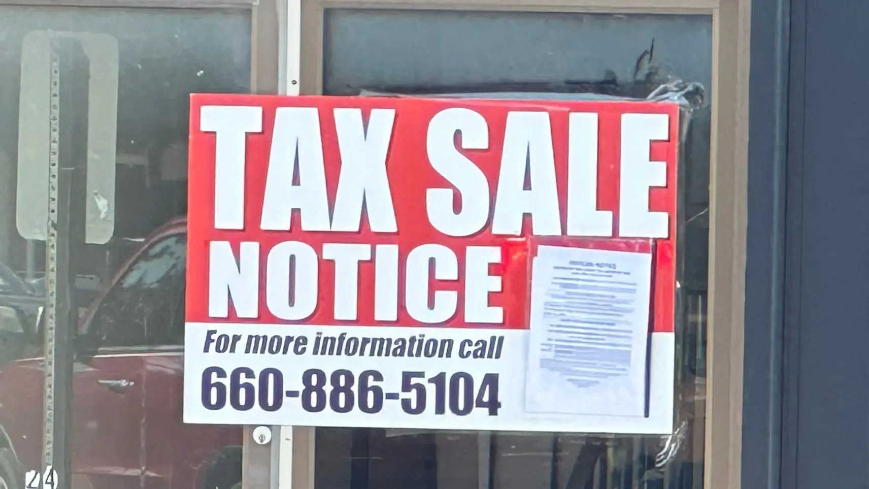 25-0808-tax-sale-sign-on-marshall-square-building